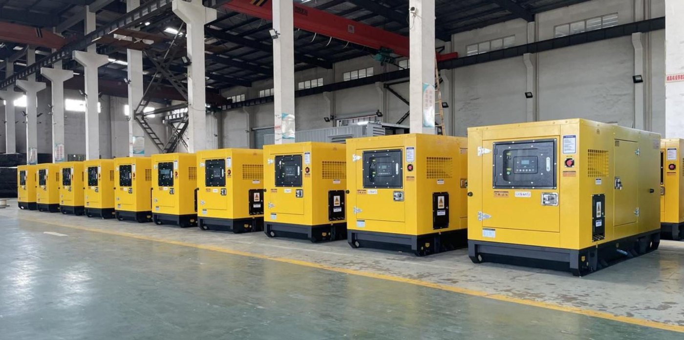 Row of silent canopy diesel generator sets in a manufacturing facility